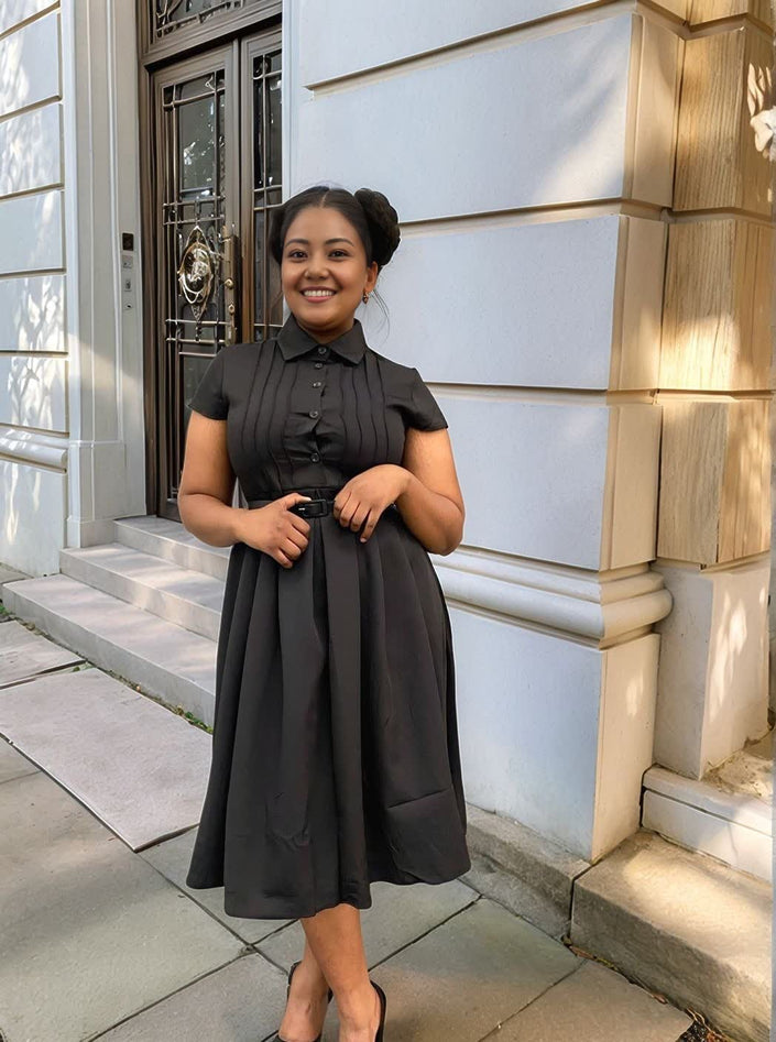 Black midi dress with short sleeves, collar, belted waist tie, pleated skirt
