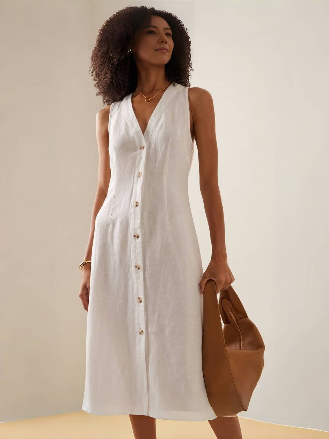 White sleeveless V-neck midi dress with button-down front and V-shaped neckline