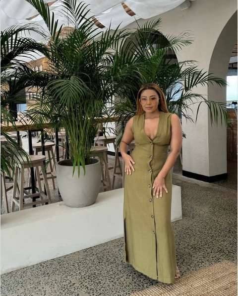 Olive sleeveless V-neck midi dress with button-down front and long vertical seam details