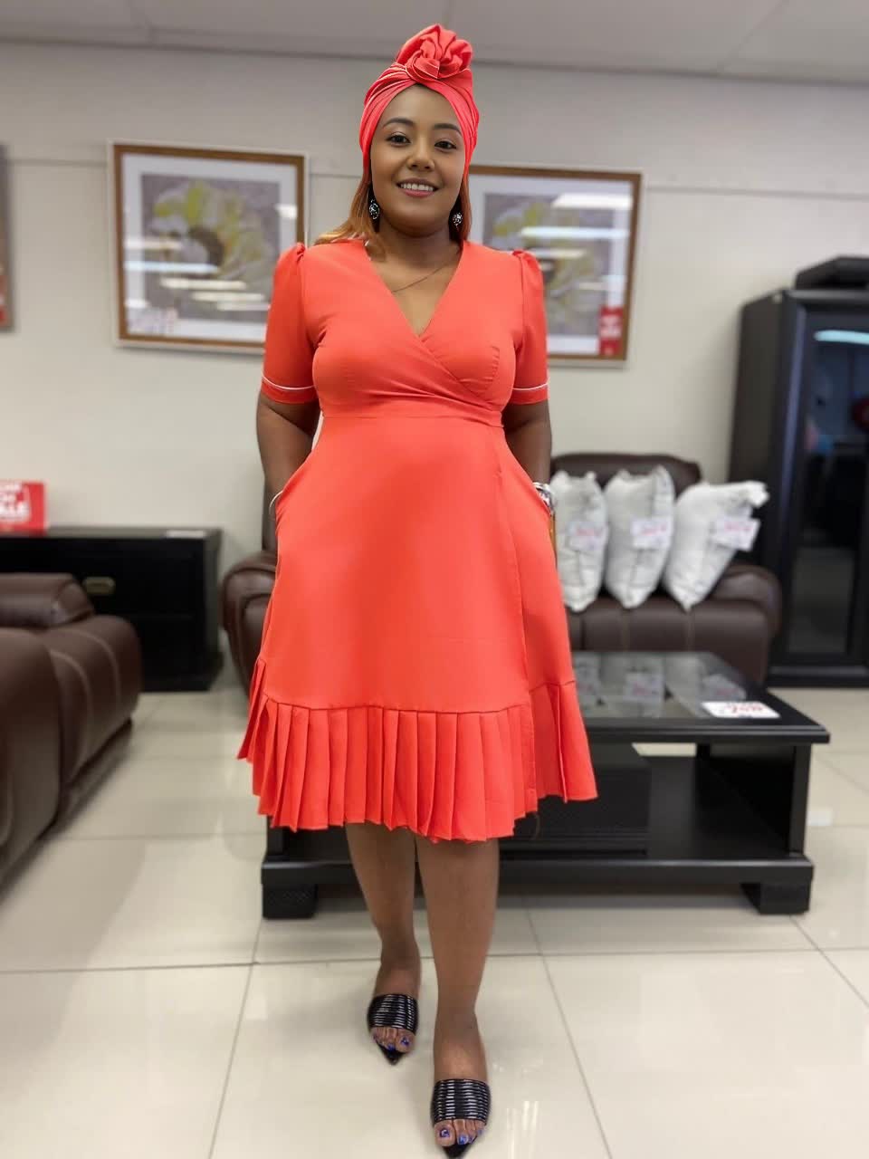 Plus size wrap midi dress in orange-red with short sleeves and tiered ruffle hem