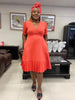 Plus size wrap midi dress in orange-red with short sleeves and tiered ruffle hem