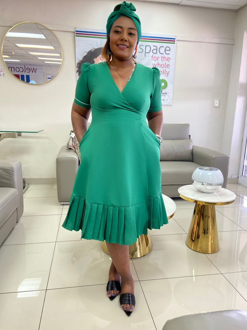 Plus size wrap midi dress in dark green, V-neck with short sleeves and ruffle hem