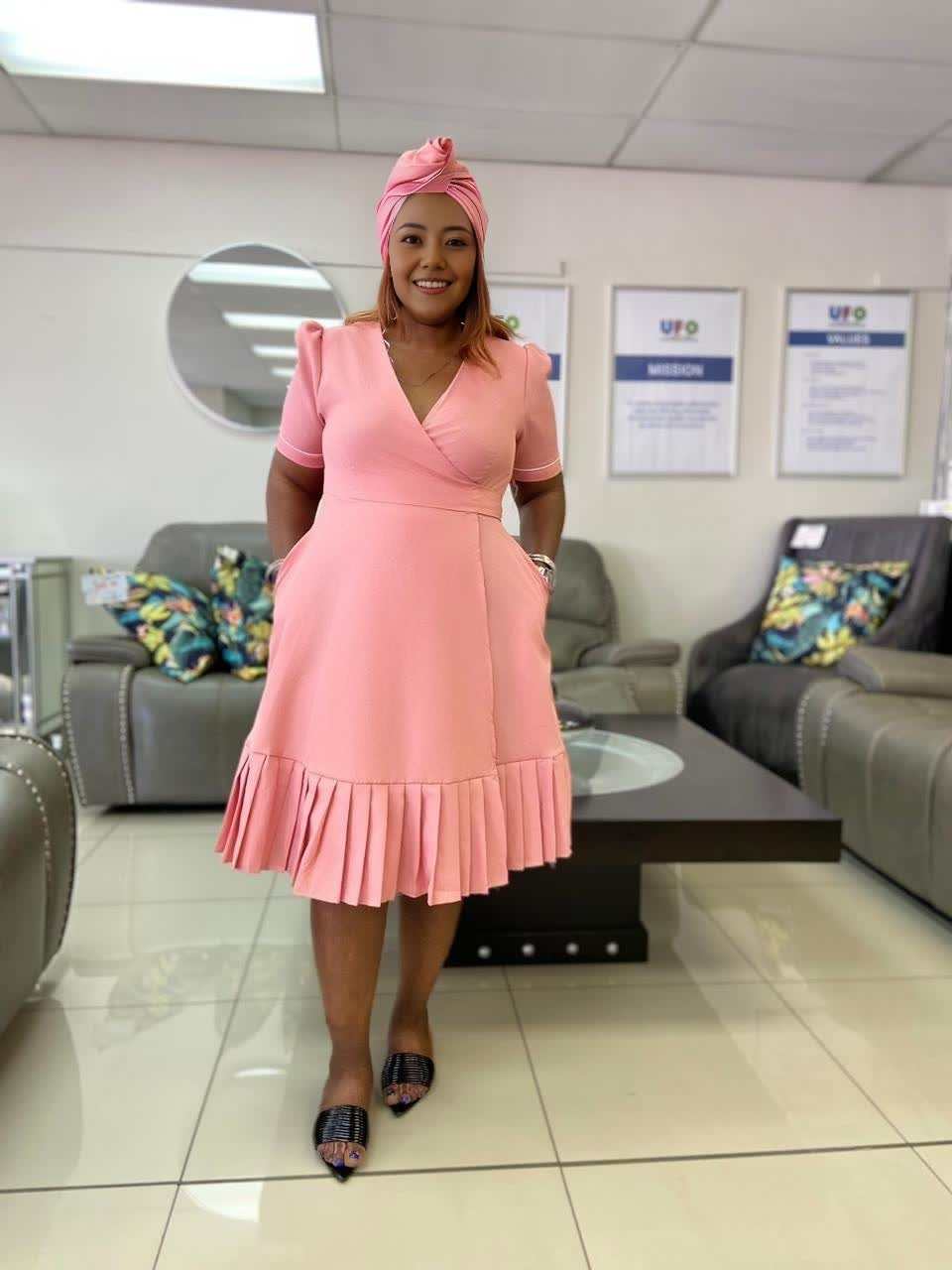 Plus size wrap midi dress in dusty pink with short sleeves and pleated ruffle hem