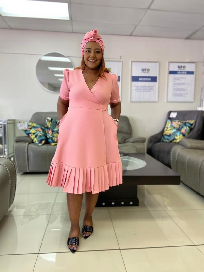 Plus size wrap midi dress in dusty pink with short sleeves and pleated ruffle hem