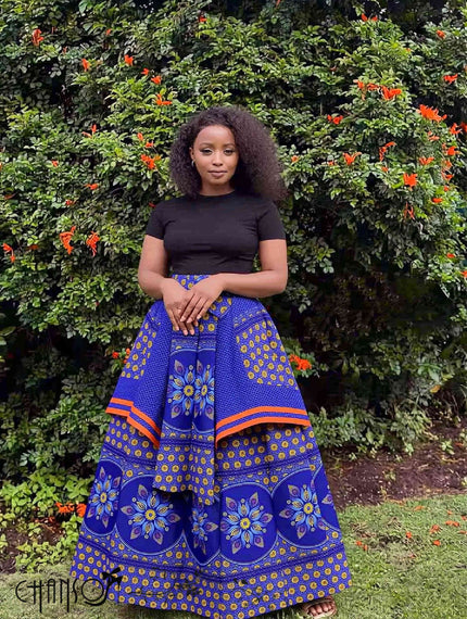 Blue floral African print maxi skirt with wide border stripes and gathered full skirt