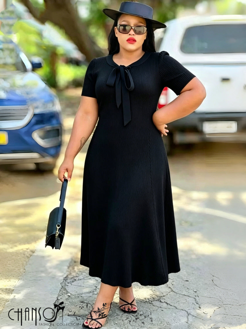 A-line ribbed midi dress in black with bow tie neck detail, short sleeves