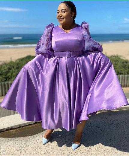 Plus size midi dress with puff sleeves, belted waist, flared skirt in lavender purple