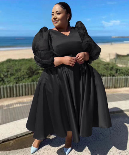 Plus size midi dress with puff sleeves, belted waist, flared skirt in black
