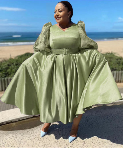 Plus size midi dress with puff sleeves, belted waist, flared skirt in light green