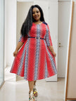 Red and white polka dot belted midi dress with 3/4 sleeves