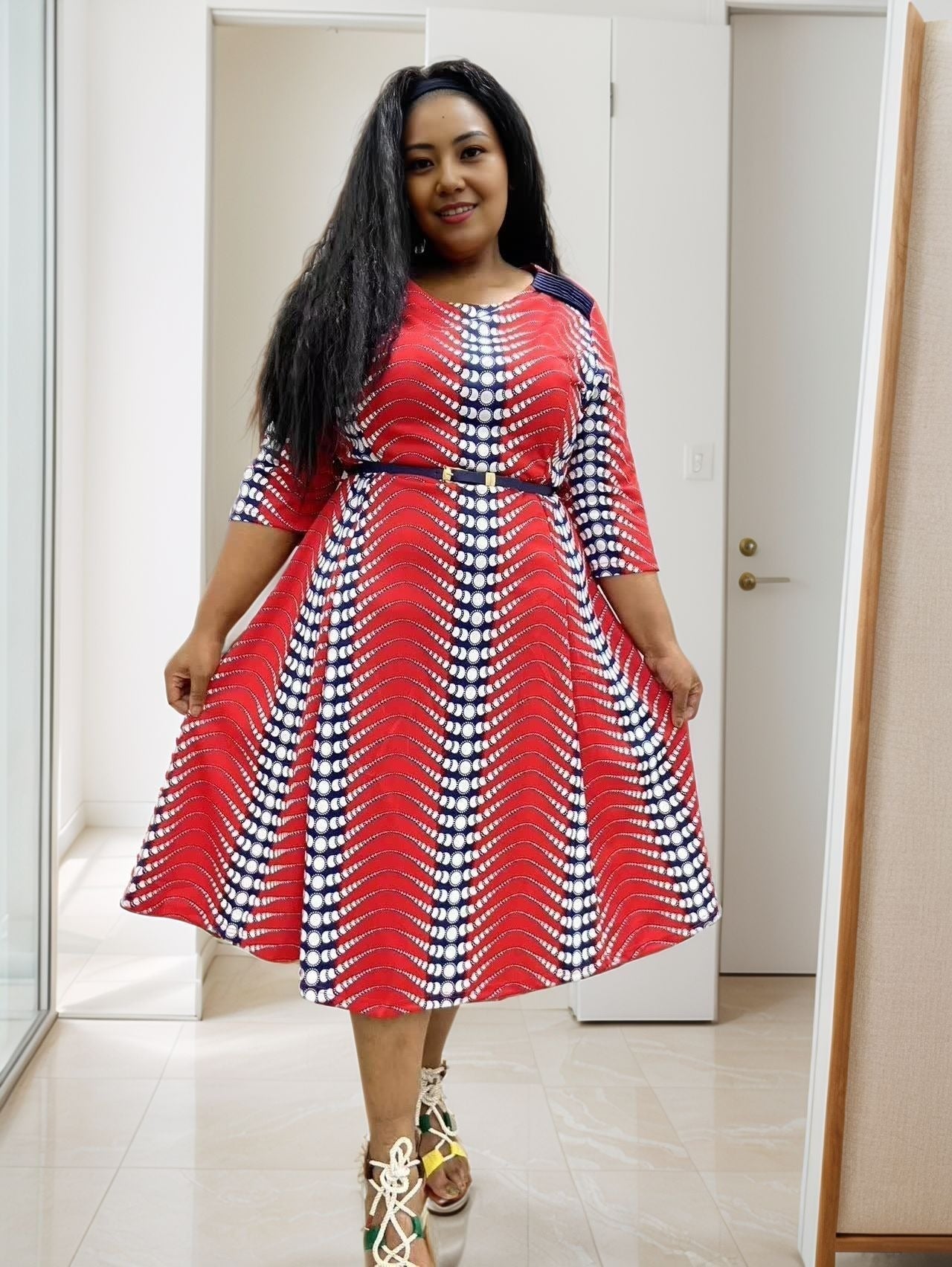 Red and white polka dot belted midi dress with 3/4 sleeves