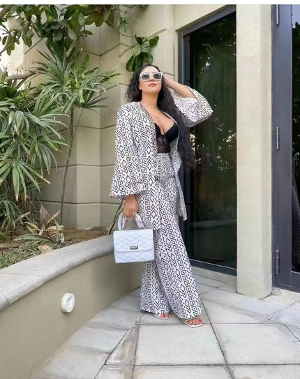Printed twin set: patterned wide-leg trousers with matching V-neck top in black and white