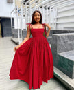 Red sleeveless square-neck maxi dress with pleated skirt and tied shoulder straps