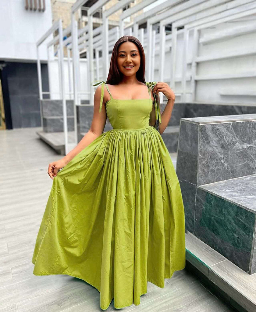 Lime-green sleeveless square-neck maxi dress with pleated skirt and tied shoulder straps