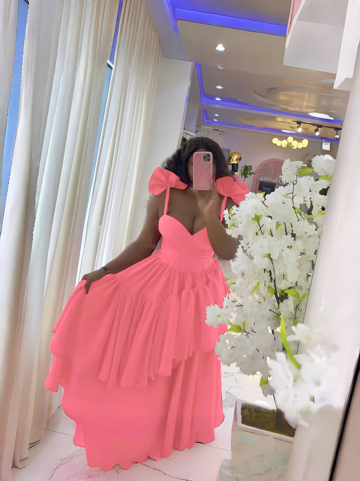 Pink layered ruffle evening dress with puffed shoulders and fitted bodice