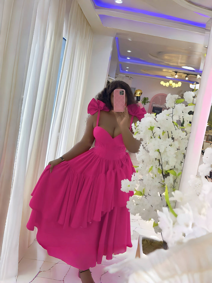 Deep pink layered ruffle evening dress with puffed shoulders and fitted bodice