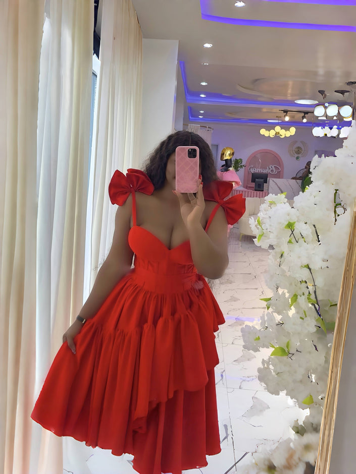 Red layered ruffle evening dress with puffed shoulders and fitted bodice