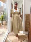 Tan midi dress with puff sleeves, white contrast collar, gathered waist button front