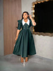 Dark green midi dress with puff sleeves, white contrast collar, fitted bodice