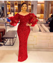 Red sequin maxi dress with sheer puff sleeves and fitted column silhouette