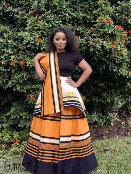 African maxi skirt set with black top and orange striped tiered skirt