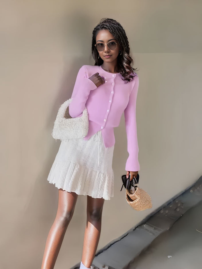 Pink knit cardigan top with button front and long sleeves