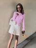 Pink knit cardigan top with button front and long sleeves