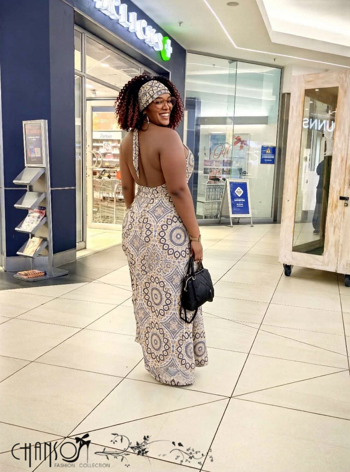 Open-back halter midi dress with circular geometric print, sleeveless