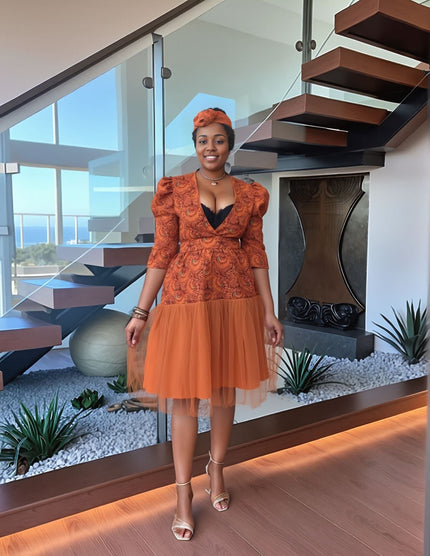 Orange embroidered midi dress with puff sleeves and tiered skirt