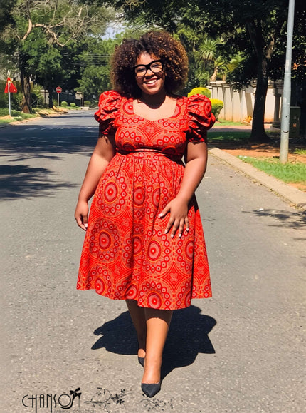 Red midi ethnic dress with square neck, puff sleeves, and circular geometric print
