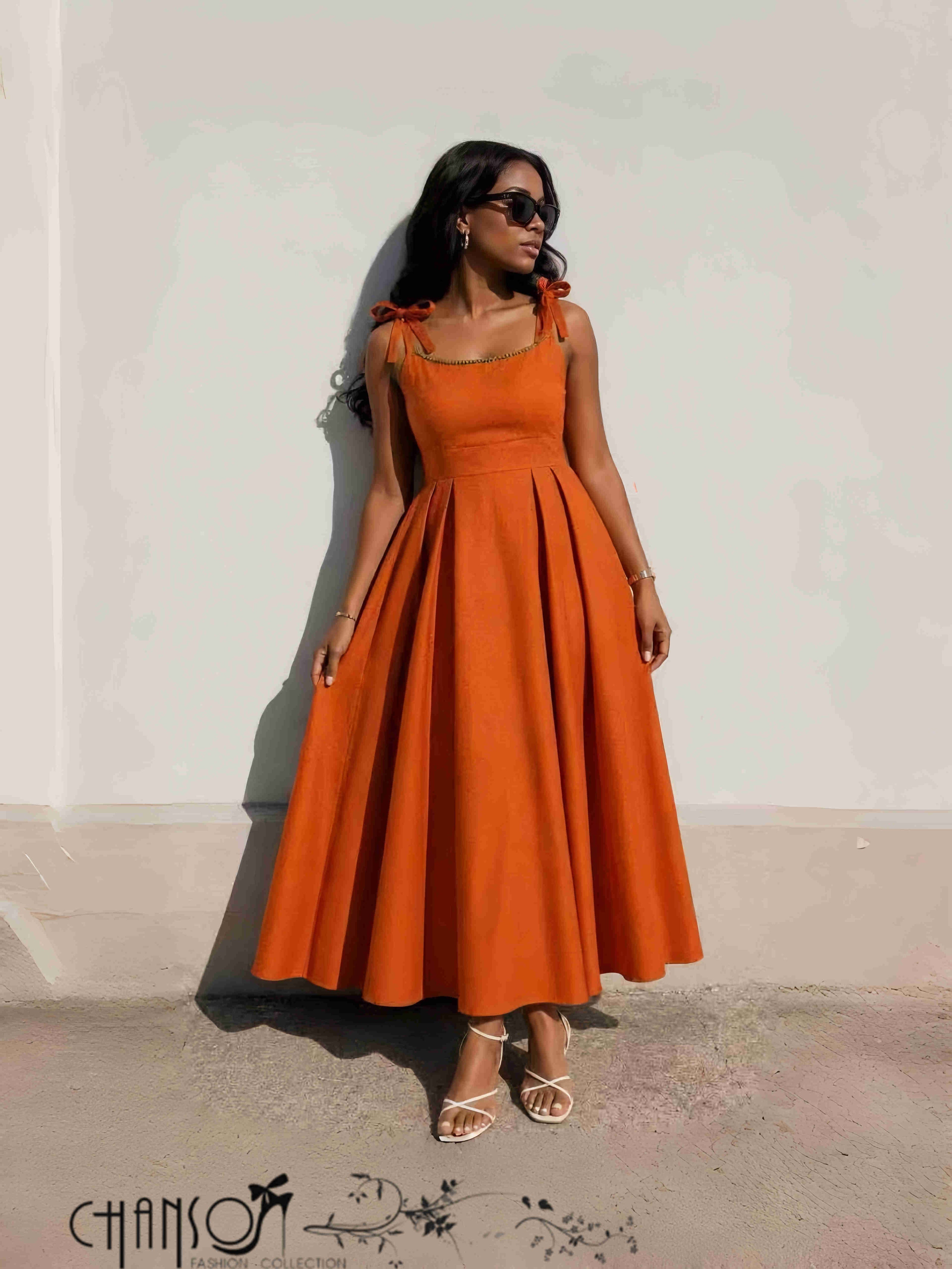 Orange midi fit-and-flare dress with bow-tie shoulder detail