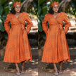Orange geometric wrap midi dress with long sleeves and V-neck, tie waist