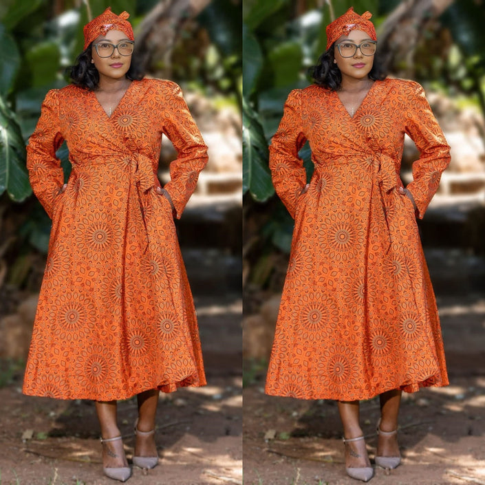 Orange geometric wrap midi dress with long sleeves and V-neck, tie waist