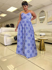 Light blue strapless maxi dress with dark blue circular print and gathered skirt