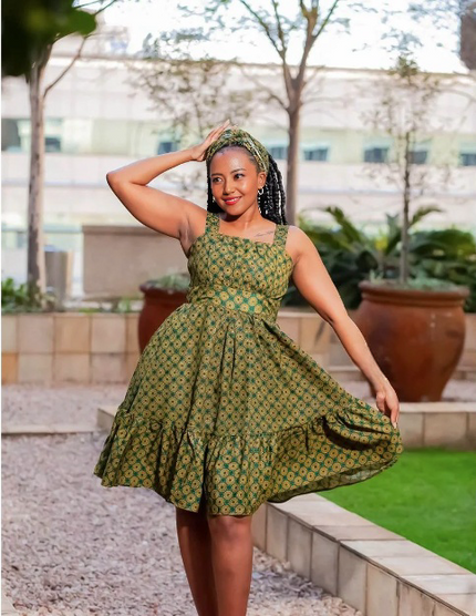 Green printed sleeveless A-line dress with gathered ruffle hem and square neckline
