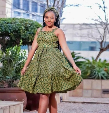 Green printed sleeveless circle dress with tiered ruffle skirt and gathered bodice