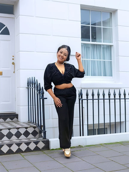 Black V-neck crop top and wide-leg pants twin set, ruched front, long sleeves