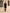 Elegant Sleeveless Mini Dress with Button Accents and Waist Pocket Design
