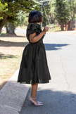 Belted vintage puff sleeve midi dress in black, ruffled sleeves and cinched waist