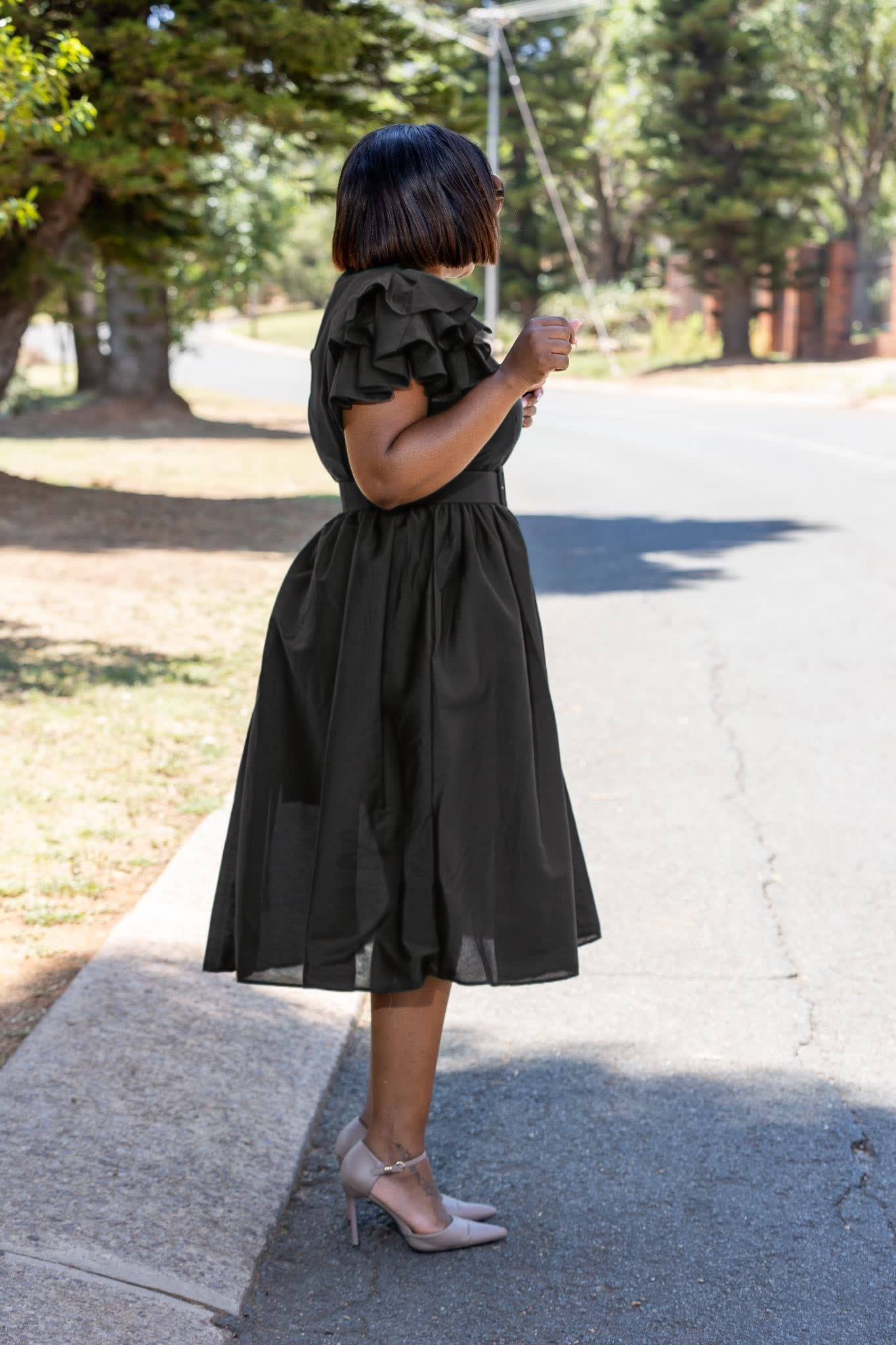 Belted vintage puff sleeve midi dress in black, ruffled sleeves and cinched waist