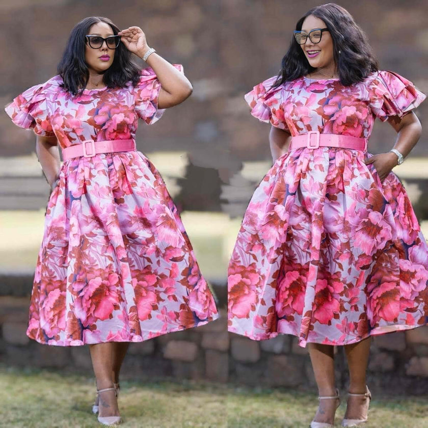 Pink floral midi dress with belted waist and puff sleeves, fit-and-flare silhouette