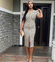 Ethnic puff sleeve midi dress with front slit, cream base and ornate orange motif.