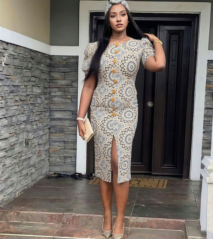 Ethnic puff sleeve midi dress with front slit, cream base and ornate orange motif.