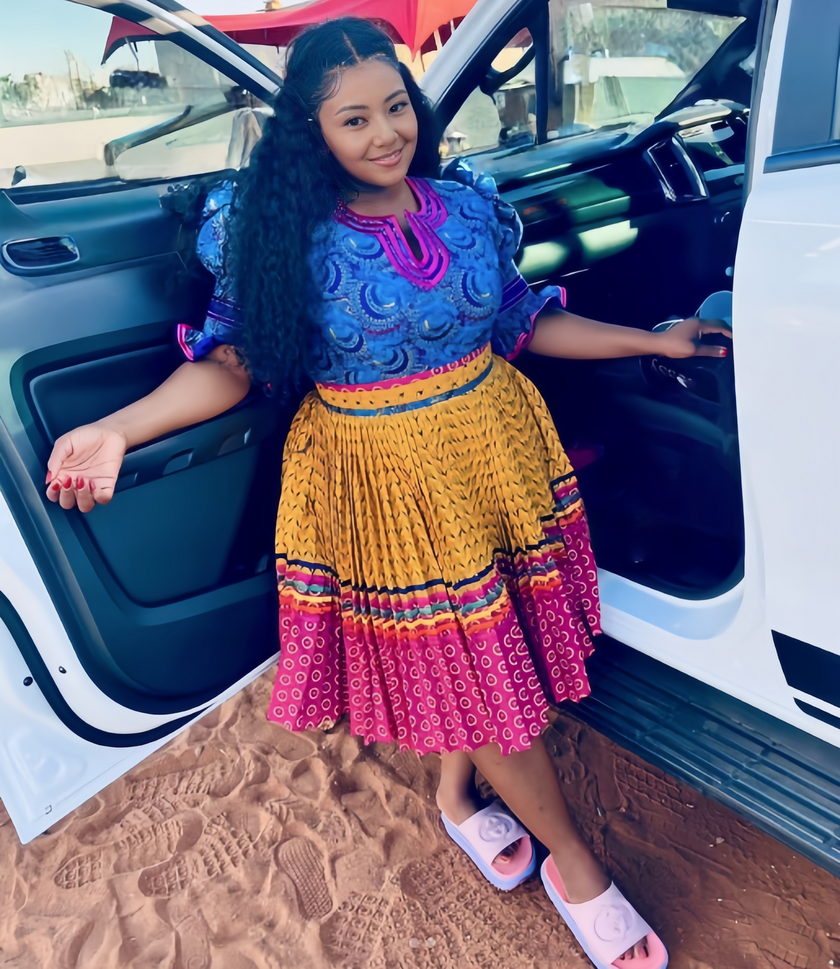 African Traditional Pleated Skirt Set with Circular Motifs and Puff Sleeve Top