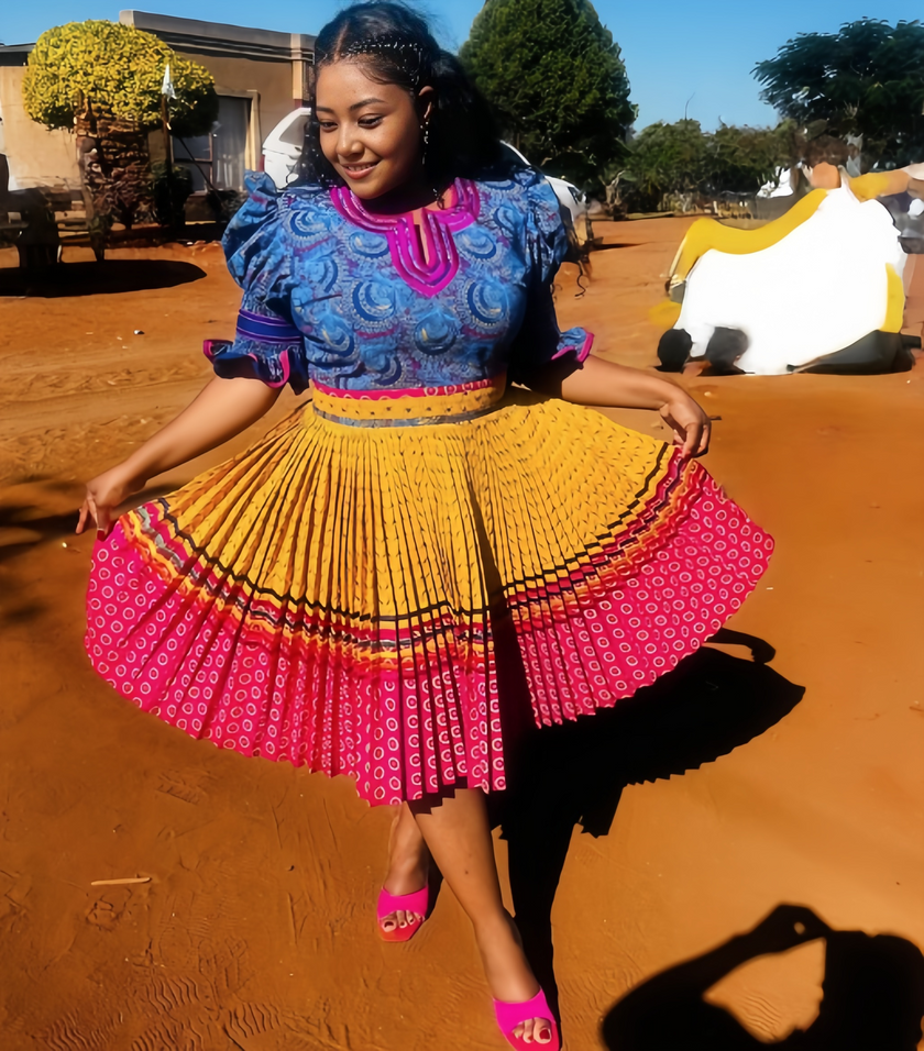 African Traditional Pleated Skirt Set with Circular Motifs and Puff Sleeve Top