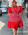 Red midi dress with puff sleeves, ruffle trim, and A-line skirt