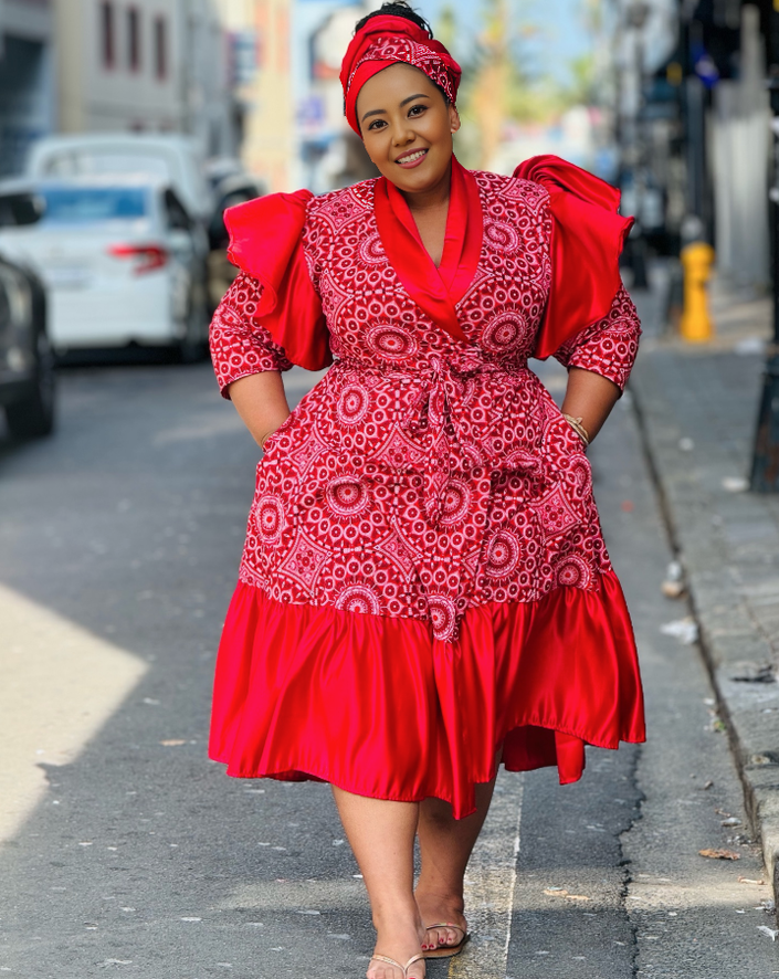 Red midi dress with puff sleeves, ruffle trim, and A-line skirt