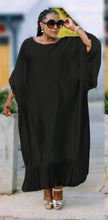 Plus size black fringe maxi dress with loose fit, wide sleeves and tassel hem