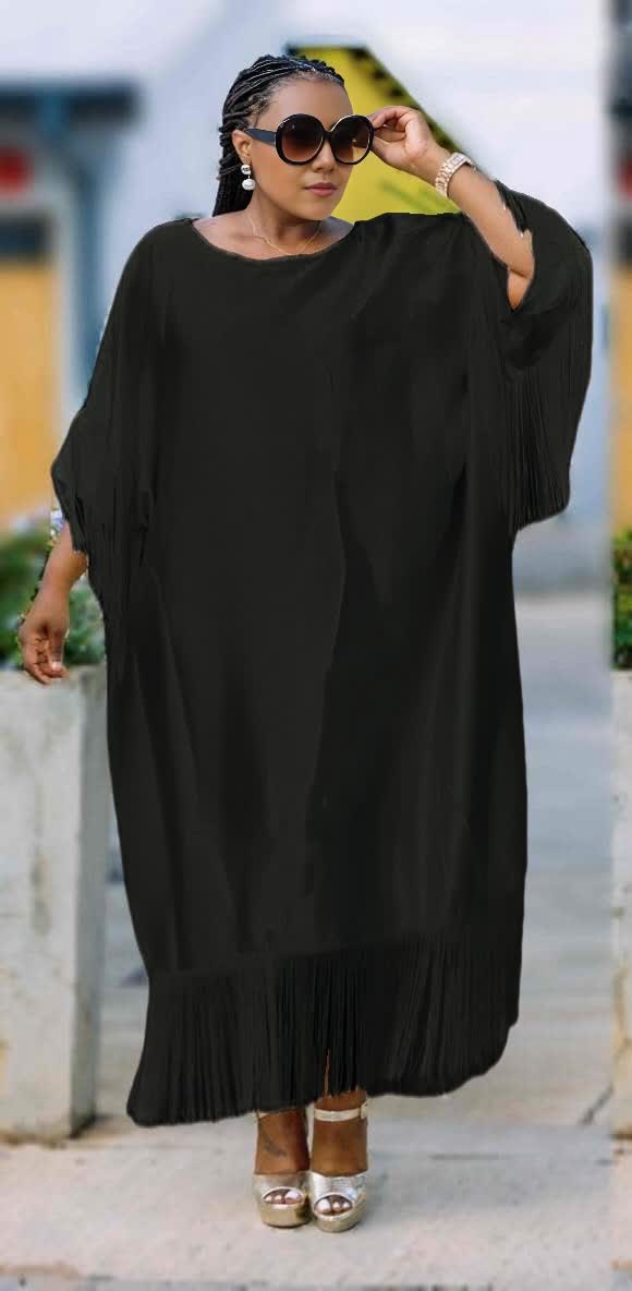 Plus size black fringe maxi dress with loose fit, wide sleeves and tassel hem