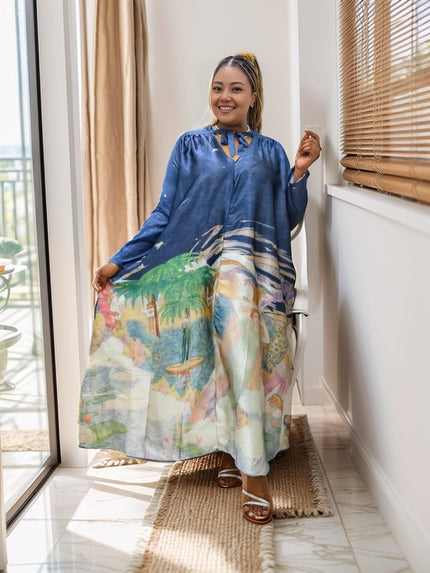 Loose-fitting printed dress with tropical landscape pattern and unique neckline design